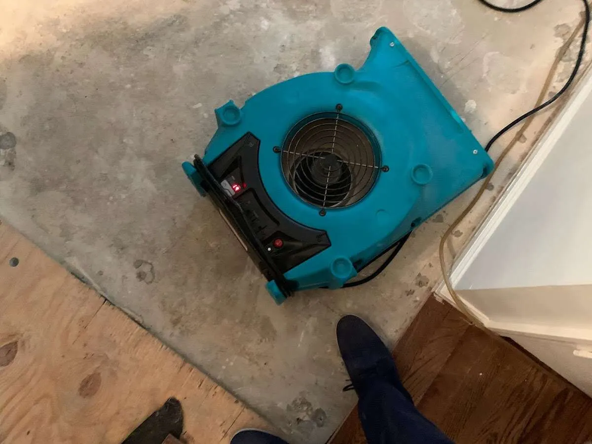 Air mover drying subfloor during Leak Detection & Repair in Conewago